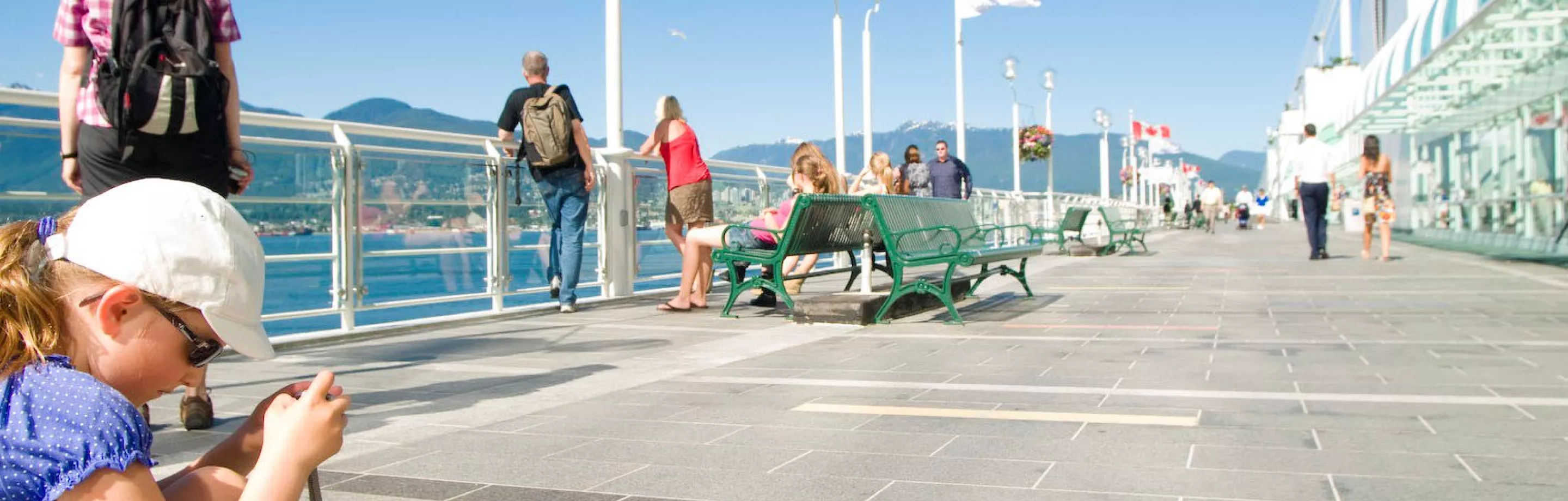 Tourist walking on the promenade at Canada Place 