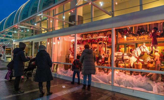 People at Canada Place enjoying the Woodwards windows display