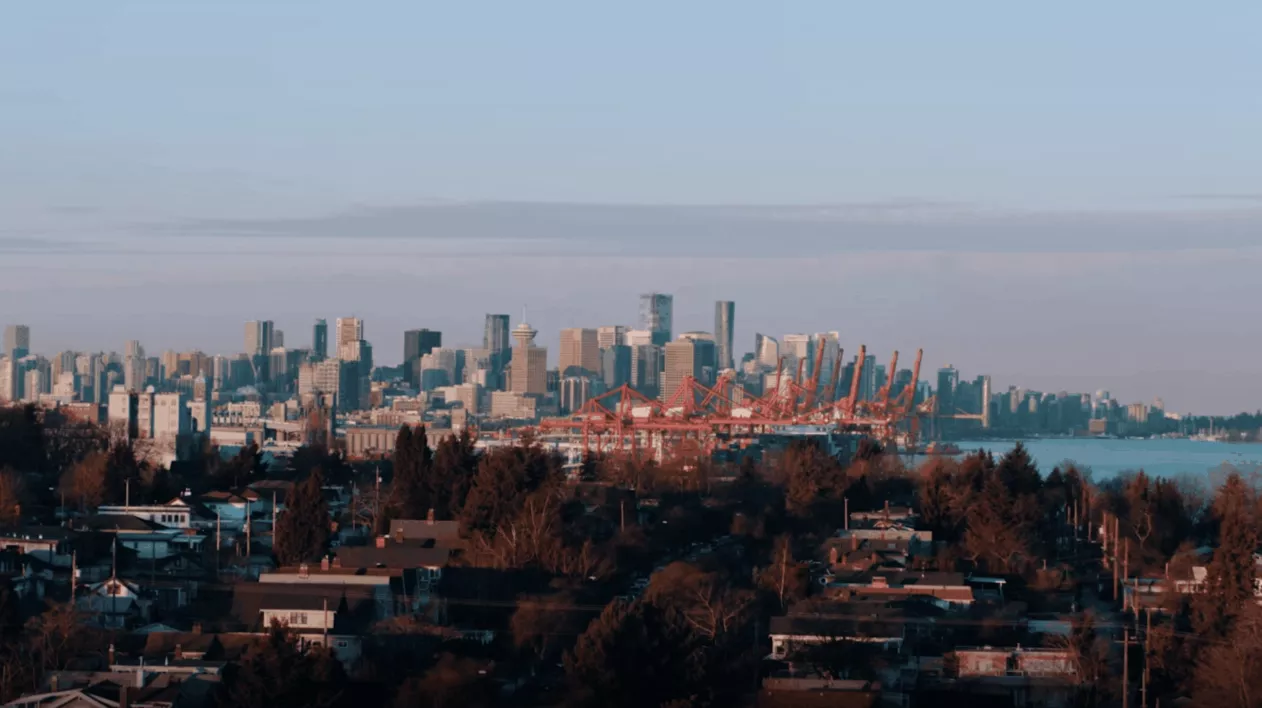 Downtown Vancouver skyline and container terminal cranes in view